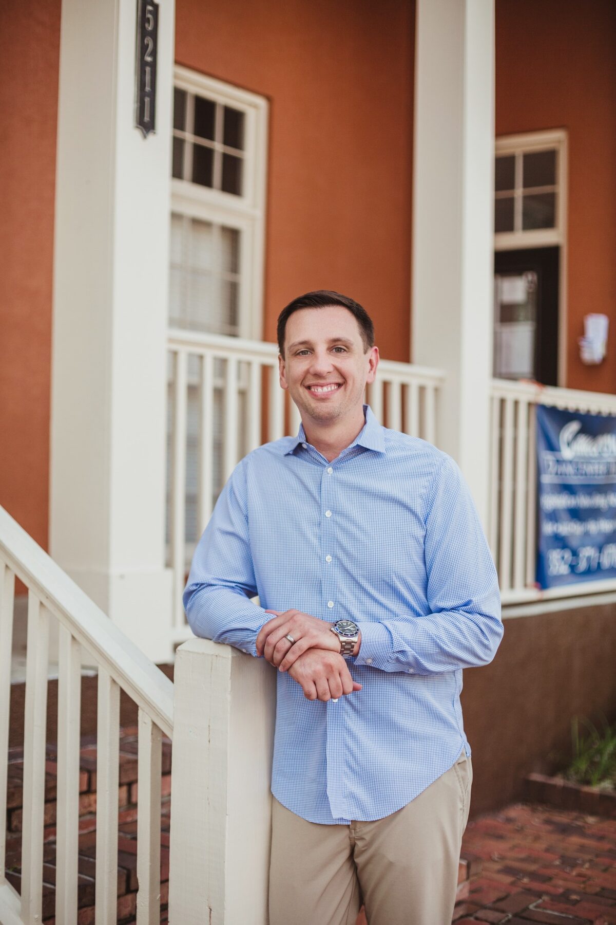 Donavan Arnold standing on a Gainesville porch